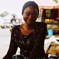 Portrait of a smiling woman, a member of the community.